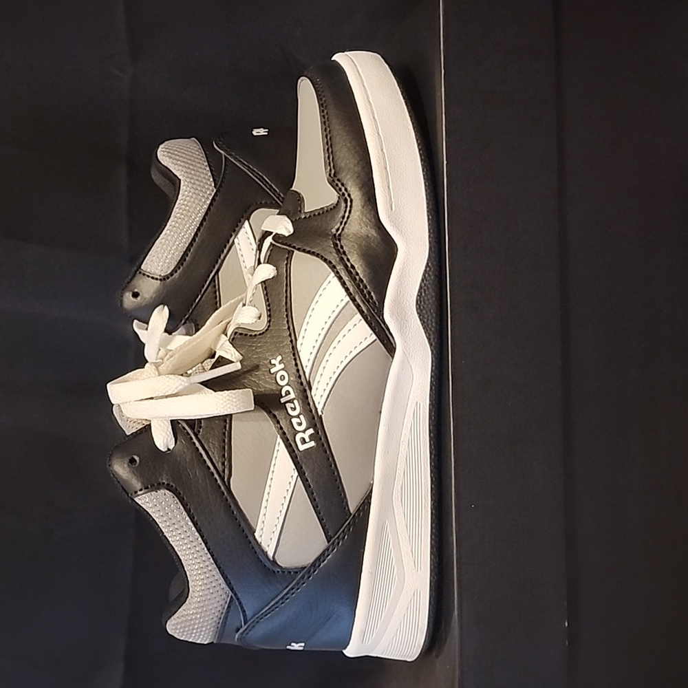 High top black, white, and grey Reebok sneakers. Size 5 (youth) 7 (women's)